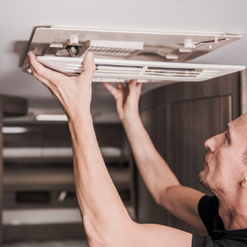 man fixing rv